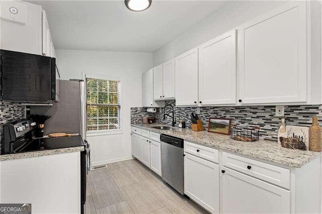 kitchen with white cabinetry, electric stove, sink, and stainless steel dishwasher