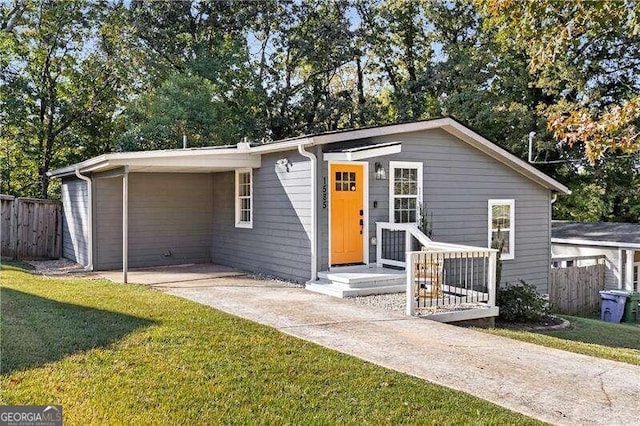 ranch-style house with a front lawn and a carport