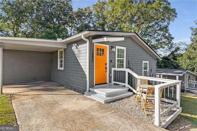 entrance to property with a carport