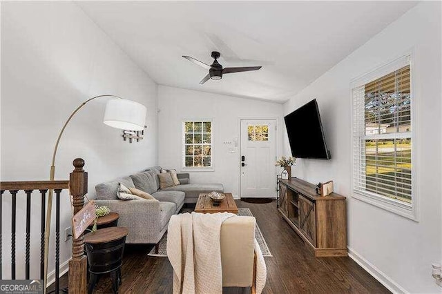 living room with lofted ceiling, dark hardwood / wood-style floors, and ceiling fan