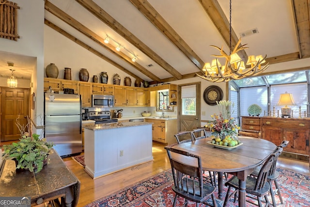 dining space featuring beam ceiling, high vaulted ceiling, light hardwood / wood-style flooring, a notable chandelier, and sink