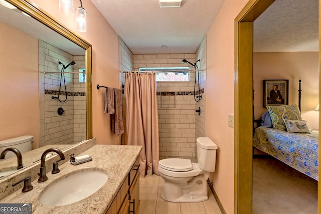 bathroom featuring vanity, toilet, walk in shower, and tile patterned flooring