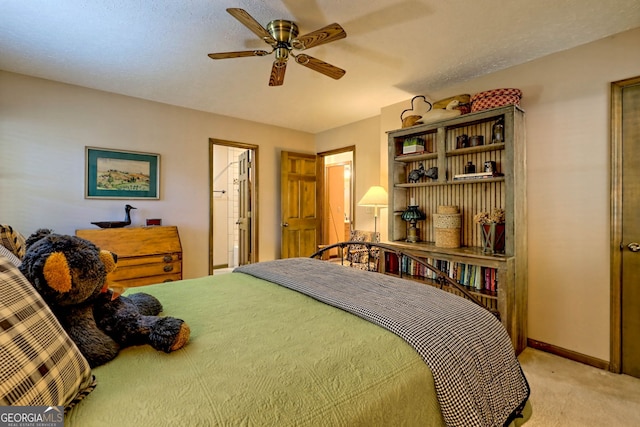 carpeted bedroom with a textured ceiling and ceiling fan