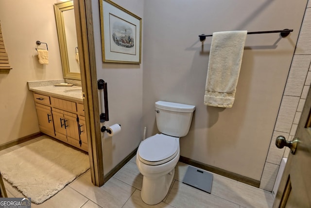 bathroom featuring vanity, toilet, and tile patterned floors