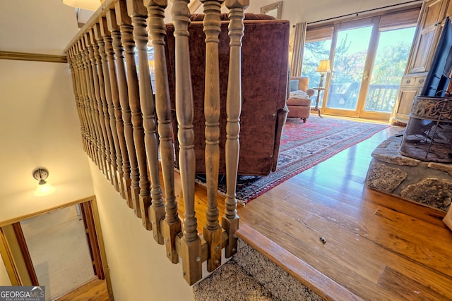842 Saddleback Cir Unit 36, Sky Valley, GA 30537 - staircase with a wood stove and wood-type flooring