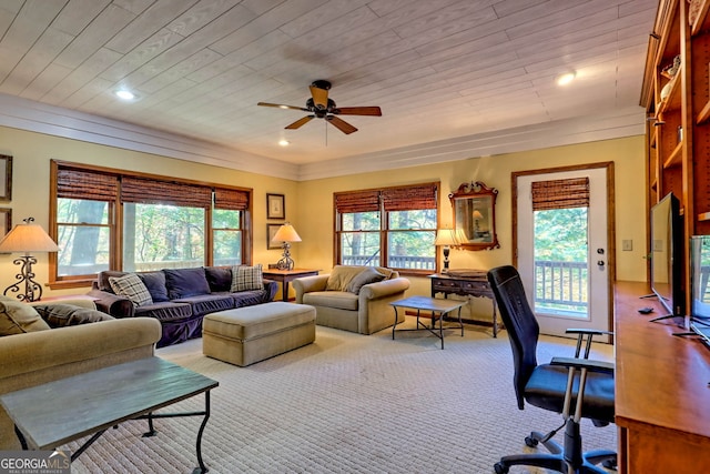 carpeted living room featuring ceiling fan and wood ceiling