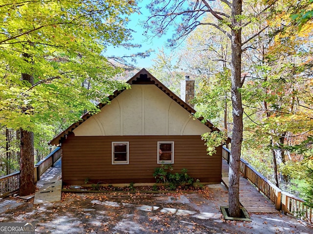 842 Saddleback Cir Unit 36, Sky Valley, GA 30537 - view of home's exterior featuring a chimney