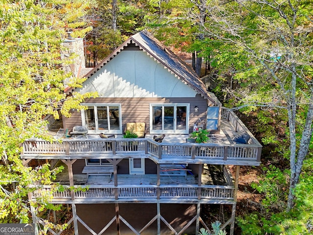 842 Saddleback Cir Unit 36, Sky Valley, GA 30537 - rear view of property with a deck and a chimney