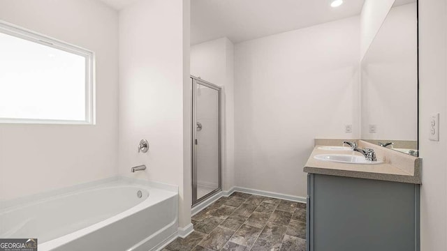 bathroom with vanity and plus walk in shower