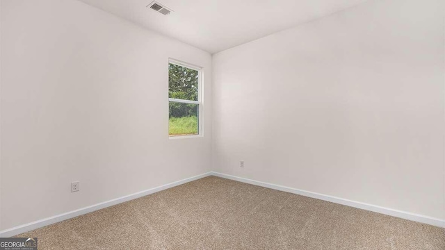 spare room featuring carpet