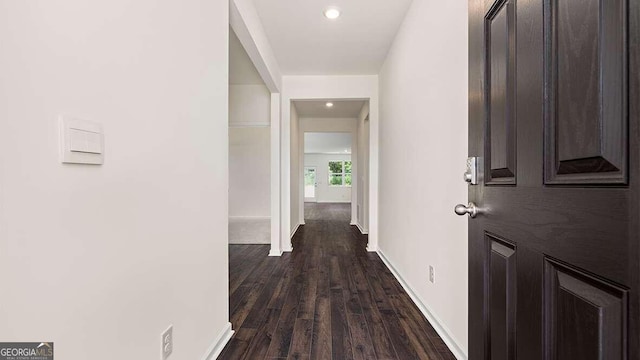 hall featuring dark wood-type flooring