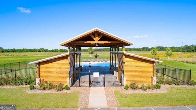 exterior space featuring a yard and a rural view