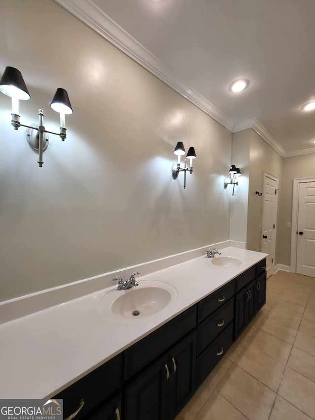 bathroom with crown molding, recessed lighting, a sink, and tile patterned floors