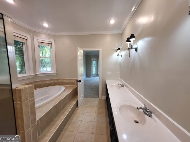 bathroom featuring crown molding, tile patterned flooring, a sink, and double vanity