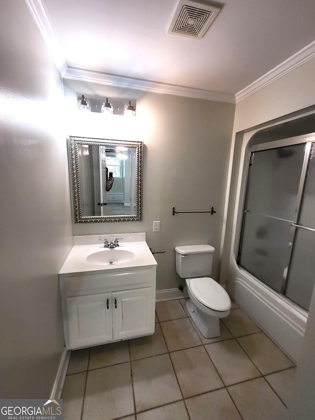 bathroom with visible vents, bath / shower combo with glass door, toilet, ornamental molding, and vanity