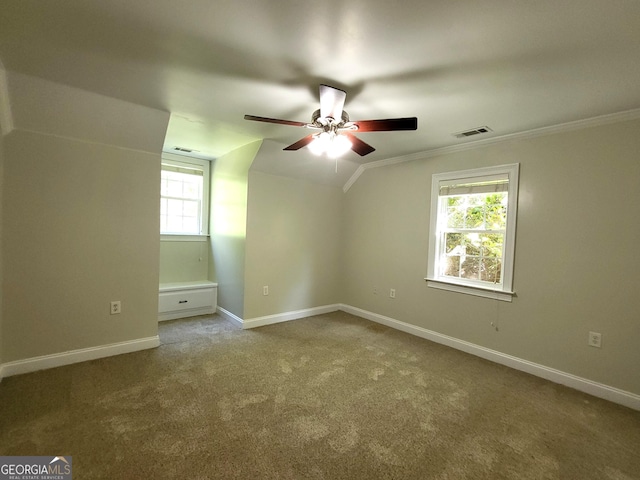 additional living space featuring lofted ceiling, baseboards, visible vents, and carpet