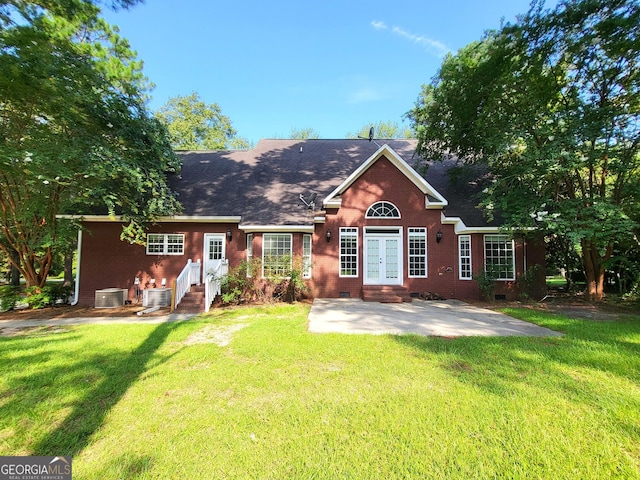 rear view of house featuring a patio, central AC, a yard, french doors, and crawl space