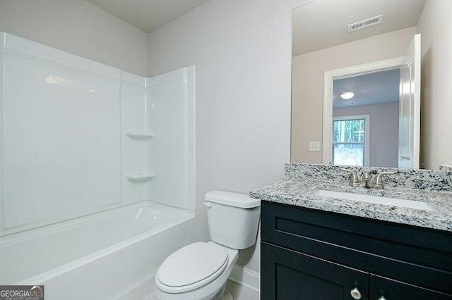 full bathroom featuring bathing tub / shower combination, vanity, and toilet