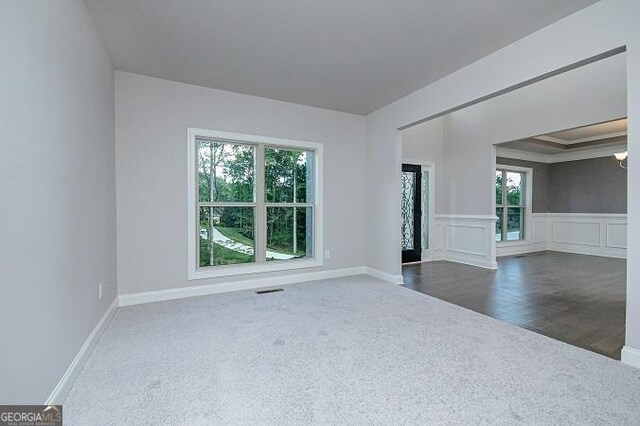 stairway featuring carpet flooring