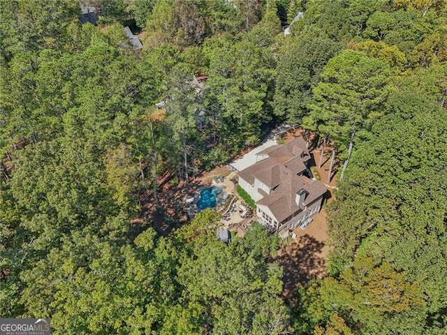 aerial view with a wooded view