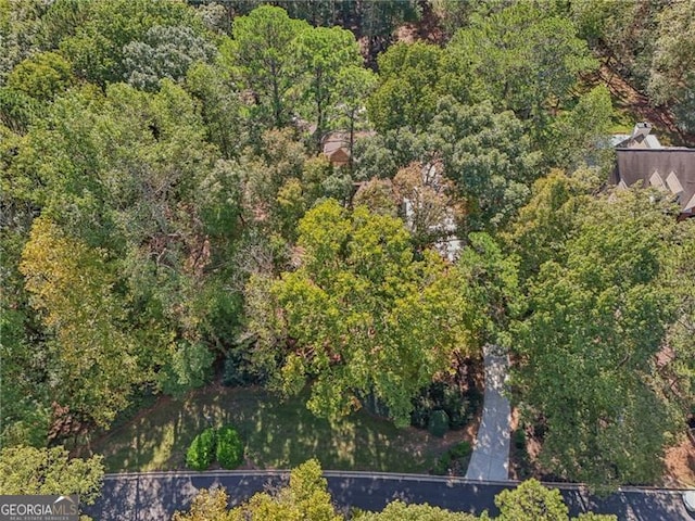 drone / aerial view with a view of trees