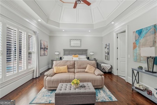 bedroom with ornamental molding, ceiling fan, and dark hardwood / wood-style flooring