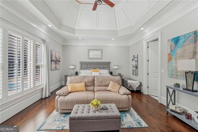 bedroom with connected bathroom, ornamental molding, dark wood-type flooring, and ceiling fan