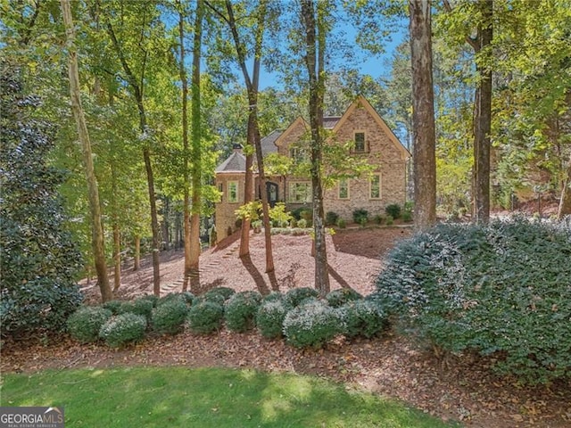 view of front of home featuring brick siding