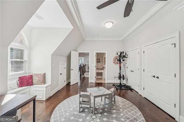 sitting room featuring crown molding, dark hardwood / wood-style floors, and ceiling fan