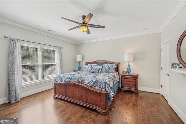 bedroom featuring ornamental molding, dark wood finished floors, and baseboards