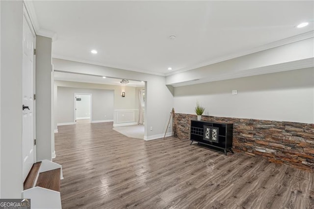 living room with ornamental molding, wood finished floors, and recessed lighting