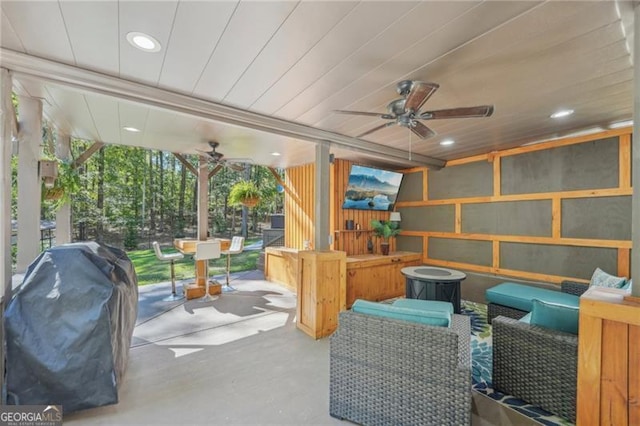 interior space with ceiling fan