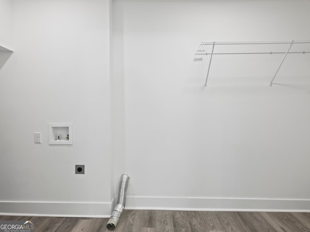 clothes washing area featuring washer hookup, hookup for an electric dryer, and wood-type flooring