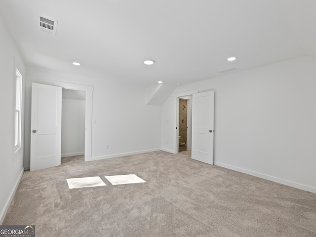 unfurnished bedroom with light colored carpet