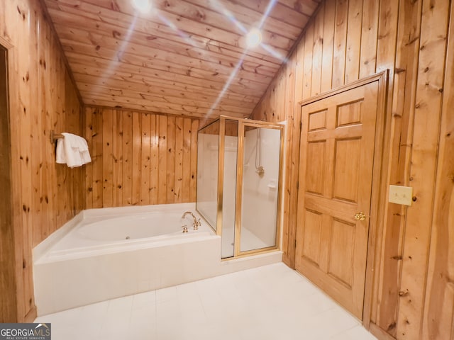 bathroom featuring lofted ceiling, separate shower and tub, and wood walls