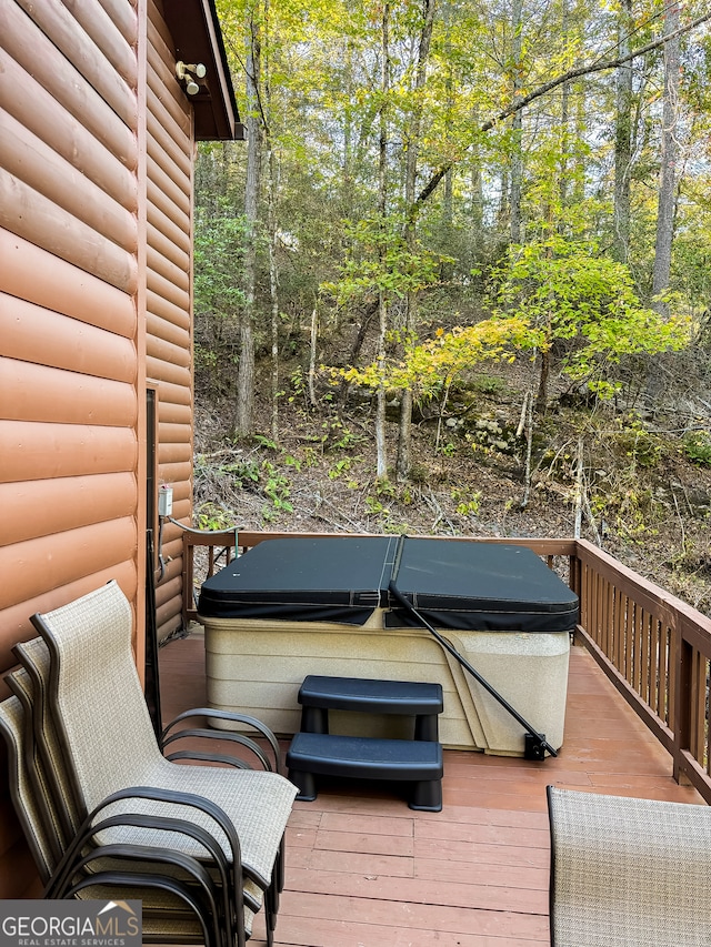 deck featuring a hot tub