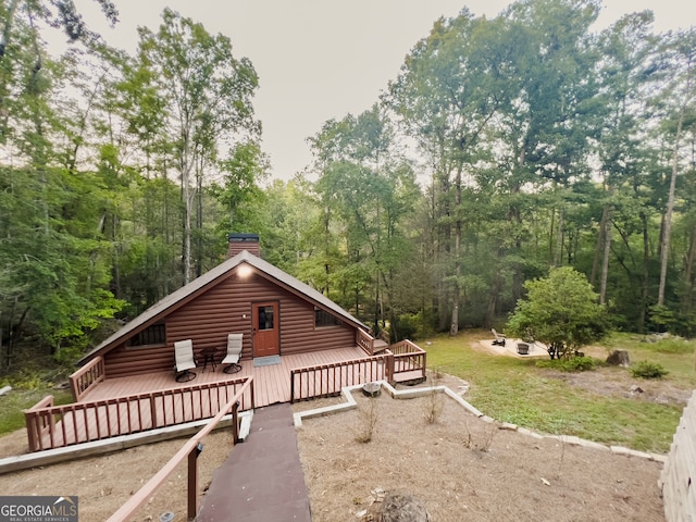 view of side of home featuring a wooden deck