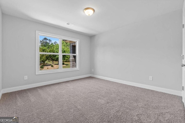 spare room featuring carpet flooring