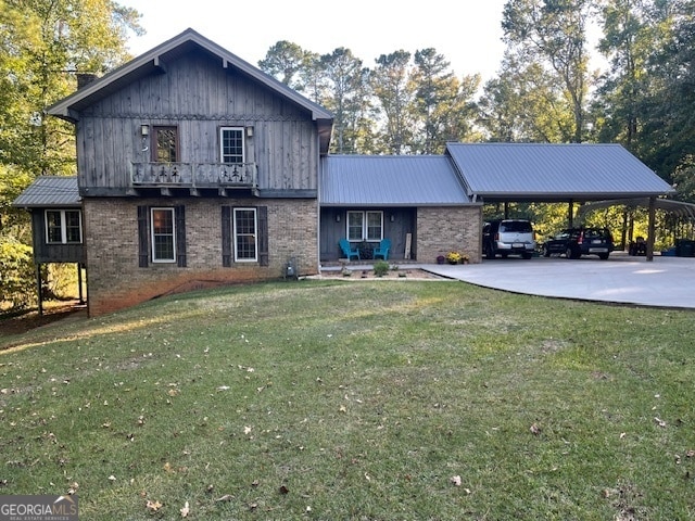 view of property featuring a front yard and a carport