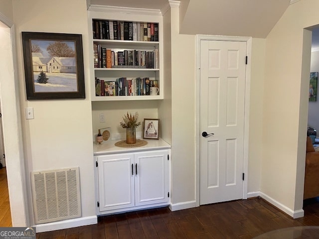 corridor with dark hardwood / wood-style floors