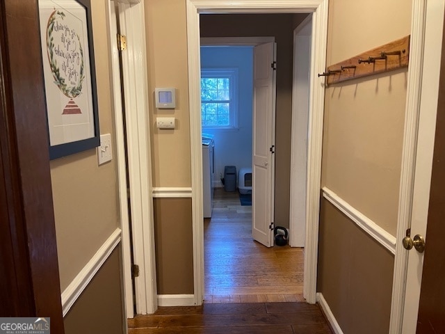 hallway with dark wood-type flooring