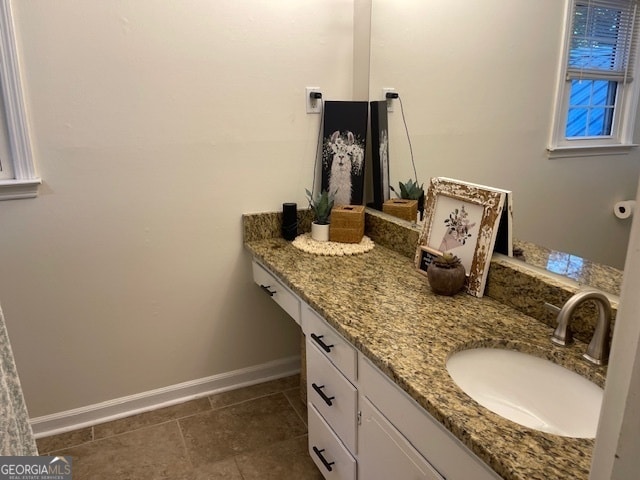 bathroom with vanity and tile patterned flooring