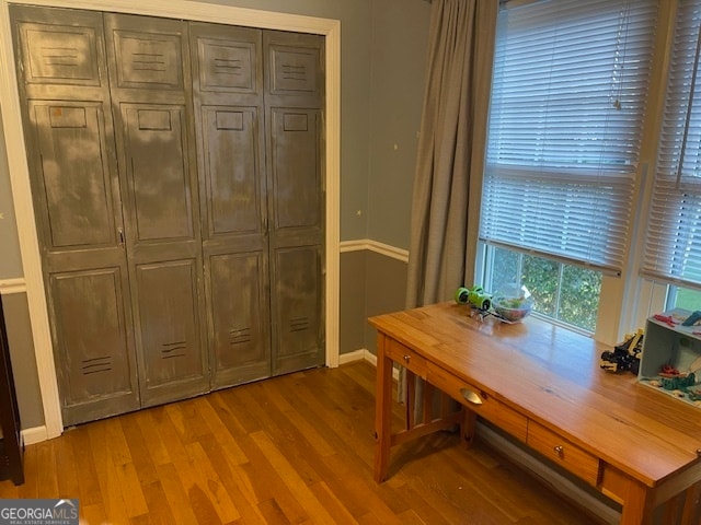 office with light hardwood / wood-style floors