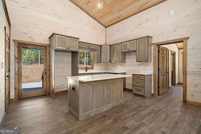 kitchen featuring wooden ceiling, a center island, dark hardwood / wood-style flooring, high vaulted ceiling, and wood walls