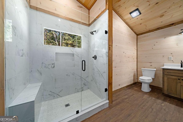 bathroom with vanity, wooden walls, toilet, and lofted ceiling