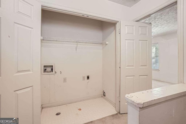 laundry area with hookup for a washing machine, light carpet, a textured ceiling, and hookup for an electric dryer