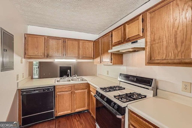 kitchen featuring black dishwasher, white gas range oven, sink, a textured ceiling, and dark hardwood / wood-style flooring