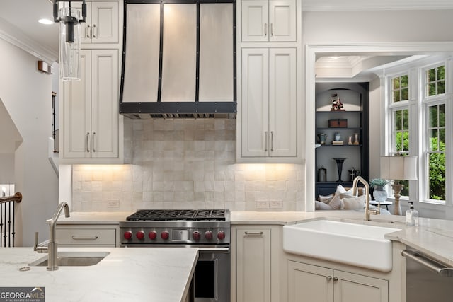 kitchen with crown molding, stainless steel appliances, light stone countertops, and sink