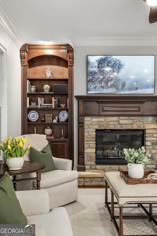 carpeted living room with crown molding and a fireplace