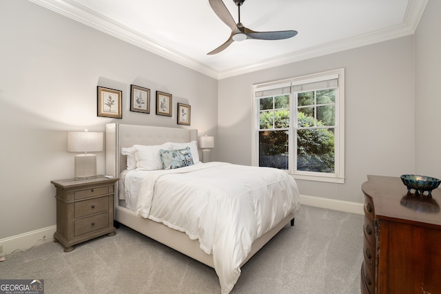 bedroom with crown molding, light colored carpet, and ceiling fan